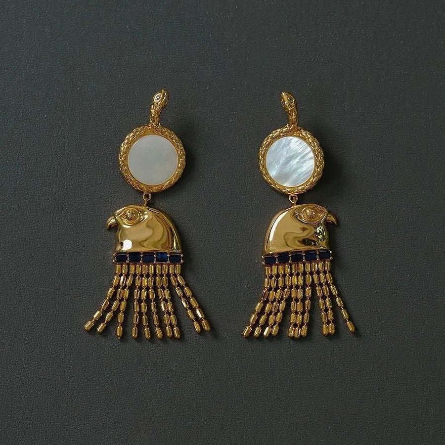 Boucle d'oreille égyptienne ancienne Tête du Dieu Horus