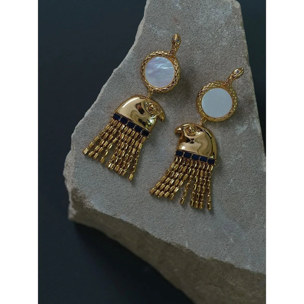 Boucle d'oreille égyptienne ancienne Tête du Dieu Horus