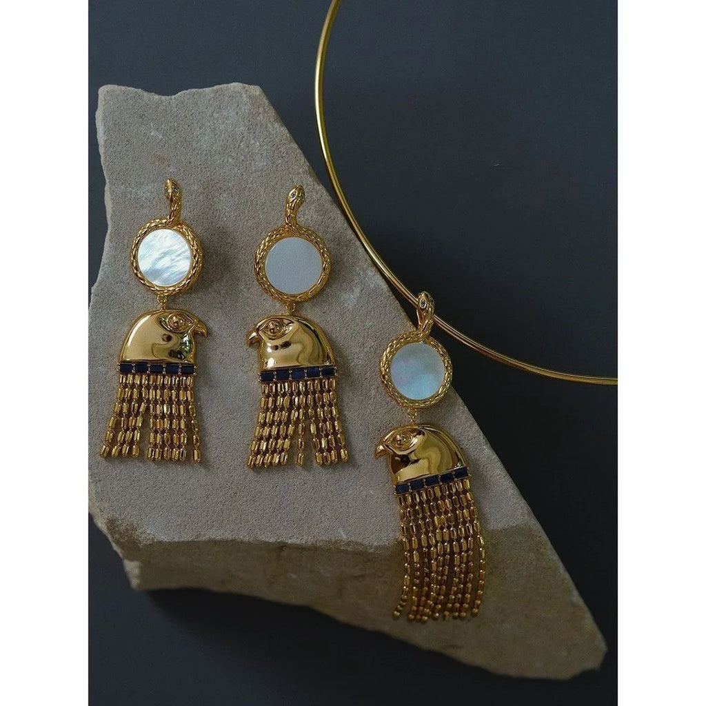 Boucle d'oreille égyptienne ancienne Tête du Dieu Horus