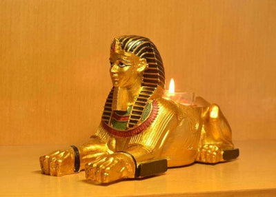 estatua egipcia<br> portavelas esfinge