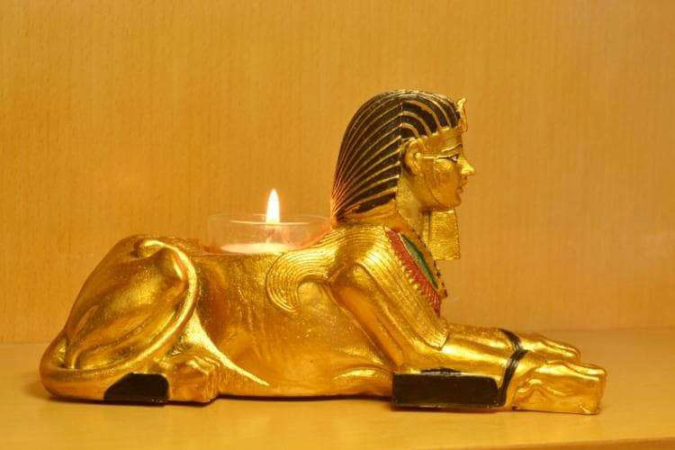 estatua egipcia<br> portavelas esfinge
